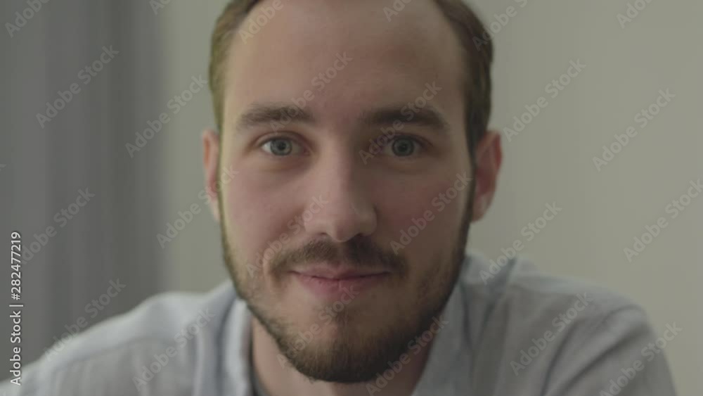 Portrait of young bearded smiling handsome man looking at camera enjoying executive lifestyle. Real people series. Portrait of young bearded smiling handsome man looking at camera enjoying executive lifestyle. Real people series.
