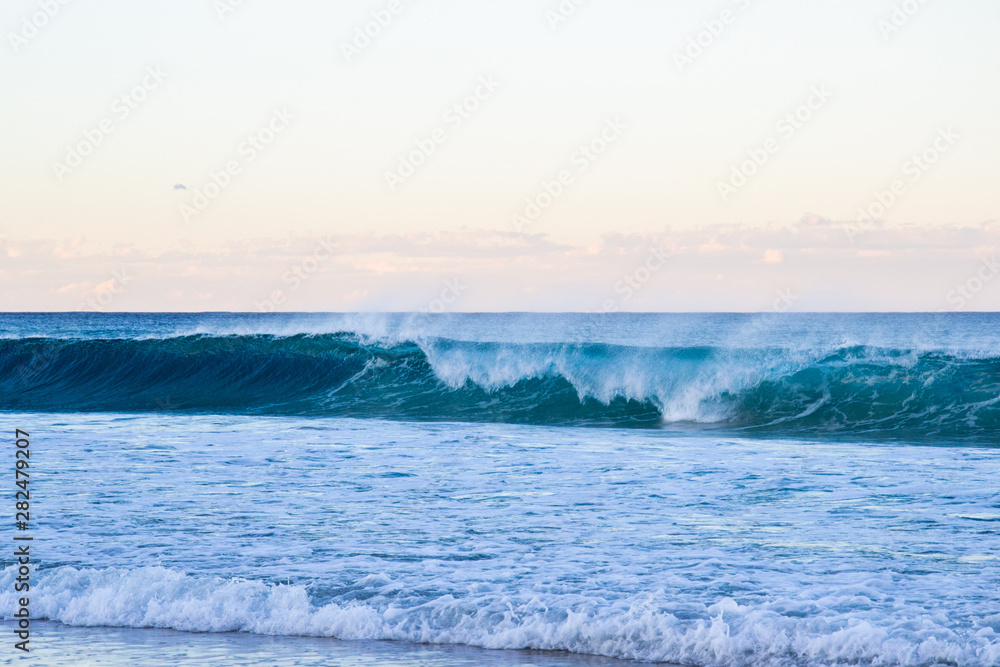 Beautiful sunset with ocean and waves