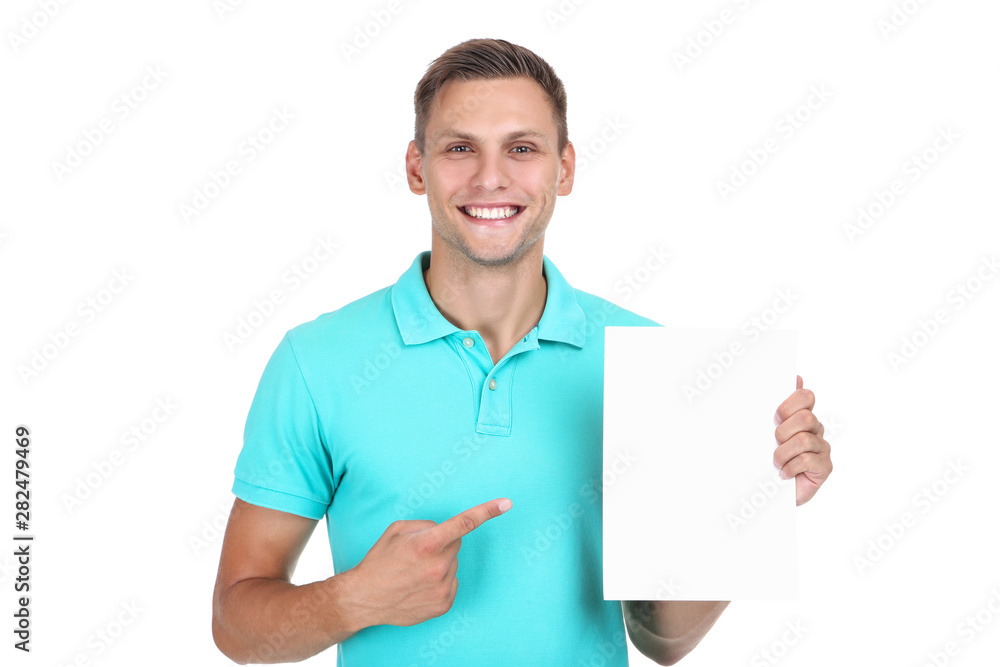 Young man with blank board on white background