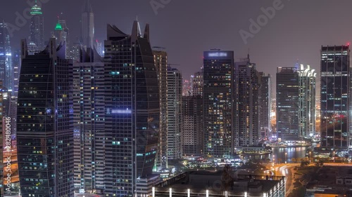 Wallpaper Mural Residential and office buildings in Jumeirah lake towers district night timelapse in Dubai. Aerial panoramic view from above with modern skyscrapers Torontodigital.ca