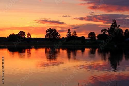 Fishing on the lake on a warm evening, in the middle of summer. A unique image of the surrounding nature.