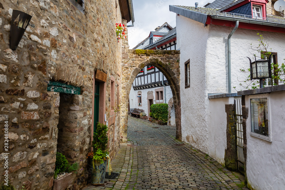 alley in the medieval village Kronenburg in the Eifel region, Germany
