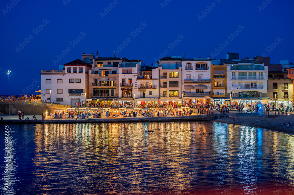 L'escala, Costa Brava, Spain, July 24 2019 nightscene of the old harbour area with an evening market with bars and restuarants
