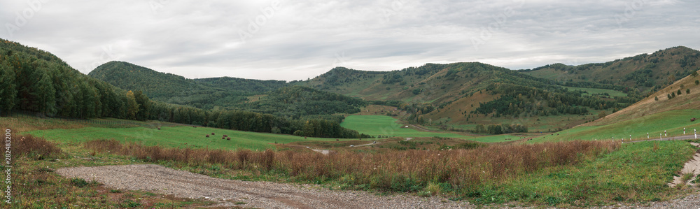 Altai mountains road through mountains pass, panoramic picture Altai mountains road through mountains pass, panoramic picture