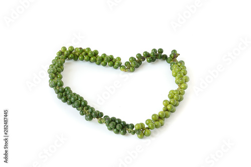 Green pepper bunch put in the heart shaped on white background