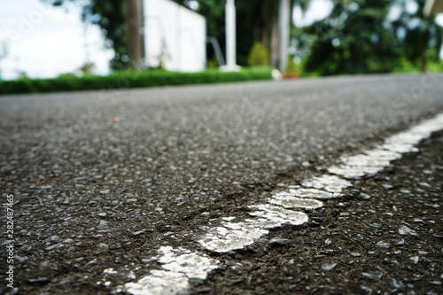 Road traffic paint on the asphalt surface