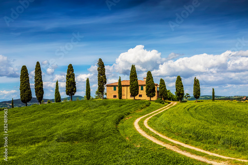 Rural landscape with lonely house and cypresses around  Tuscany  Italy