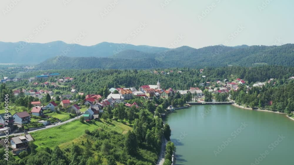 Panoramic view of town of Fuzine on beautiful Lake Bajer, Gorski kotar region, Croatia, drone aerial panning shot Panoramic view of town of Fuzine on beautiful Lake Bajer, Gorski kotar region, Croatia, drone aerial panning shot