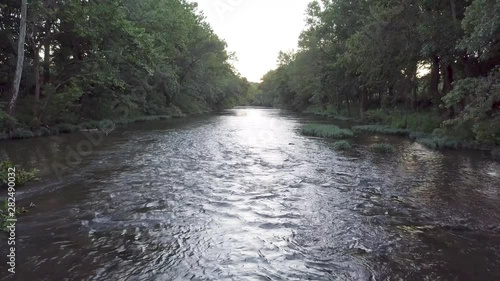 Landscape composition of ozark river during summer at sunset