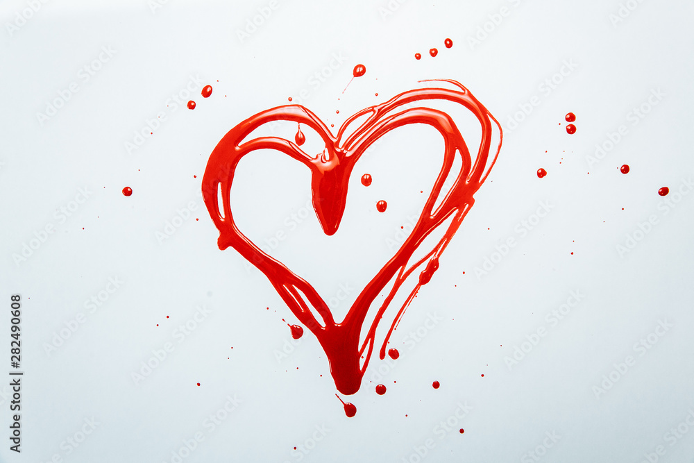 red heart on a white background with nail polish red heart on a white background with nail polish