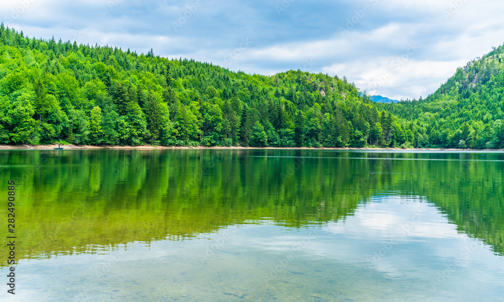 Fototapeta premium Nussensee lake in Upper Austria located near Bad Ischl in the Salzkammergut - wide panoramic view.