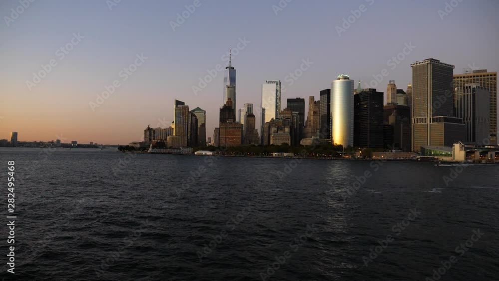 Cinematic Slow Motion, Approaching Lower Manhattan From Ocean on Sunset Sunlight. New York,Usa Cinematic Slow Motion, Approaching Lower Manhattan From Ocean on Sunset Sunlight. New York,Usa