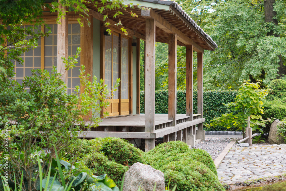 Traditional Japanese house and garden. Space for text Traditional Japanese house and garden. Space for text