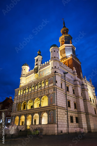 Renaissance town hall tower with clock at night in Poznan.