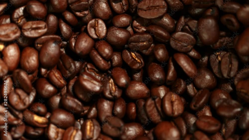 Super slow motion of grinding coffee beans. Filmed on high speed cinema camera, 1000 fps. Super slow motion of grinding coffee beans. Filmed on high speed cinema camera, 1000 fps.