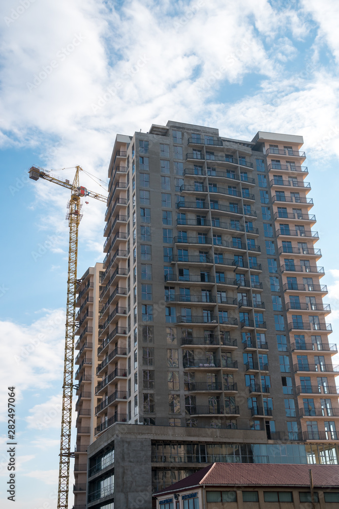new multi-family houses against the blue sky. new multi-family houses against the blue sky.