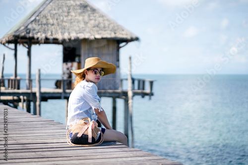 An alone woman sitting on the wood bridge - Koh mark, Thailand