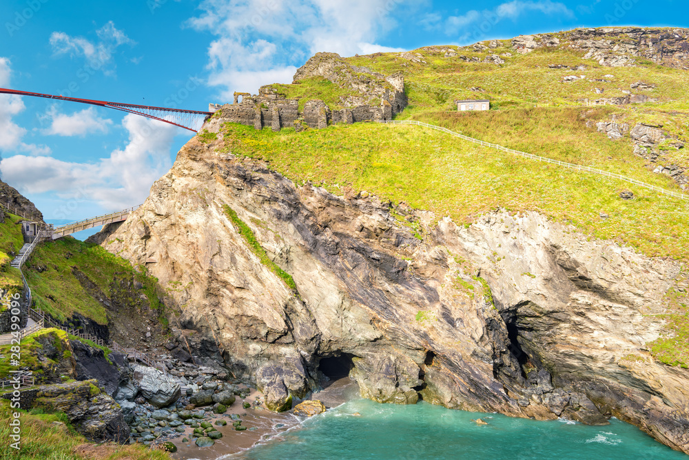 View to Tintagel island, legendary Tintagel castle ruins and Merlin's cave.