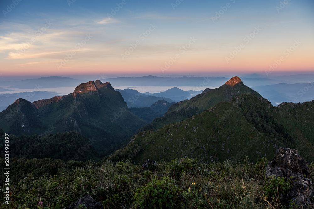 Landscape of mountain range in wildlife sanctuary at sunrise