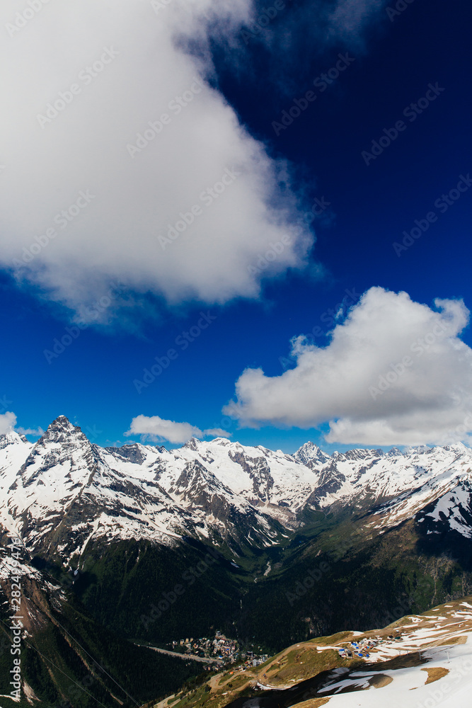 Snowy mountains. Beautiful landscape of mountains and blue sky