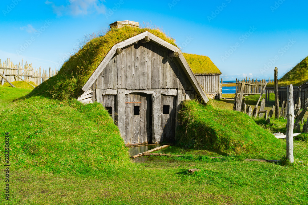 Traditional antique Viking village. Old wooden houses near Vestrahorn mountains on the Stokksnes Peninsula, Hofn, Iceland. Popular tourist attraction. Traditional antique Viking village. Old wooden houses near Vestrahorn mountains on the Stokksnes Peninsula, Hofn, Iceland. Popular tourist attraction.
