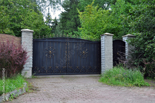 Iron front gate of a beautiful home.