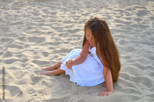 Cute little girl on the beach.Summer marine weekend