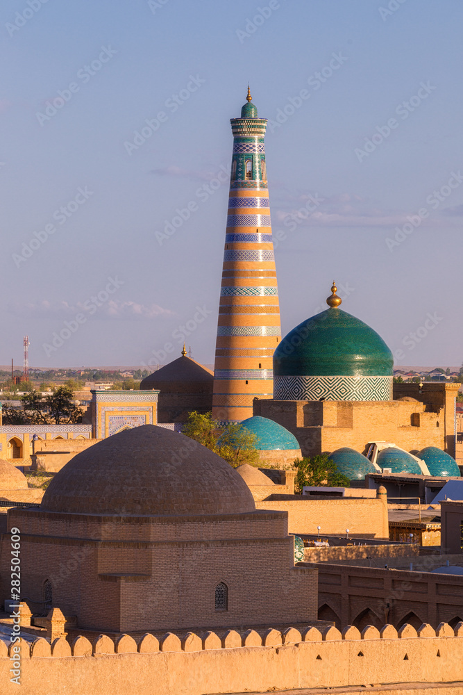 Mosques and minarets in Khiva Uzbekistan at sunset
