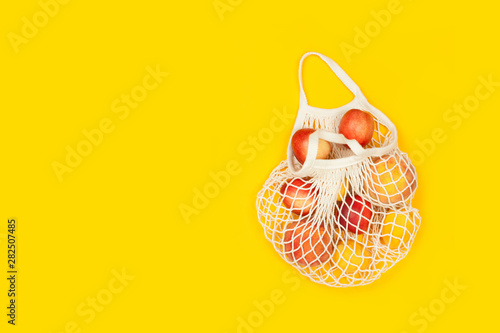 peaches and apricots in eco bag with copy space