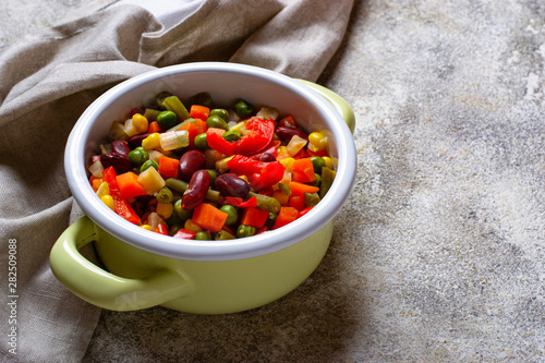 Boiled mix of vegetables in green pot