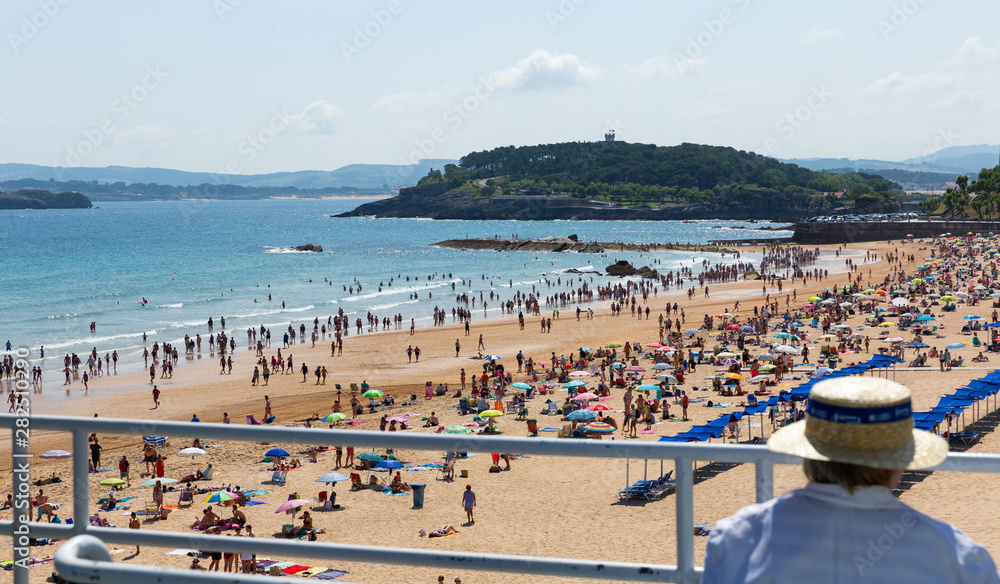 Santander, Spain - July 14, 2019: Crowded beach in Santander seaside, Spain