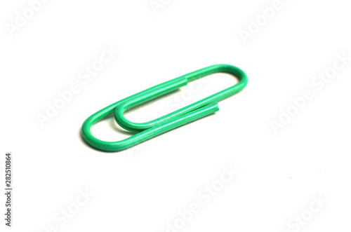 Paper clips  made of iron  are curved in a white background