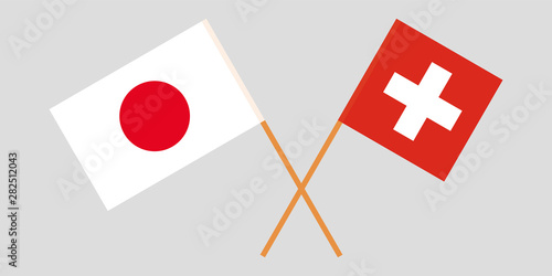 Japan and Switzerland. Crossed Japanese and Swiss flags