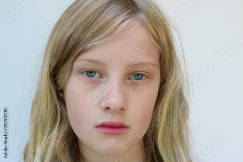 Фотография Portrait of an adolescent child with a defiant glare