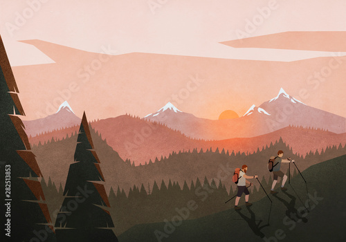 Men hiking along idyllic, tranquil sunset mountain and forest landscape photo