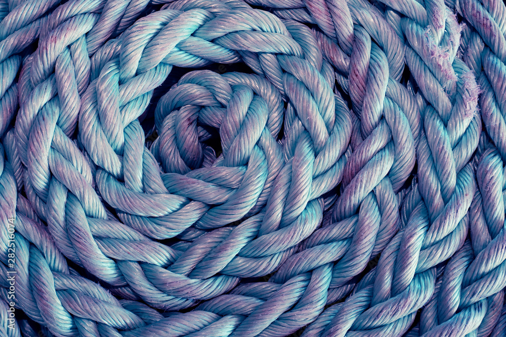 Texture of rope close up background, twisted rope of blue and violet color Texture of rope close up background, twisted rope of blue and violet color