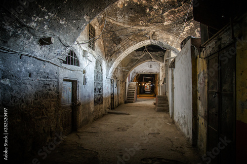 Dark brick abandoned tunnel, abstract exit to light concept background © Ruslan Gilmanshin