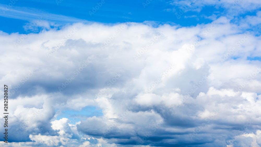 low cumulus white clouds in blue sky on summer day low cumulus white clouds in blue sky on summer day