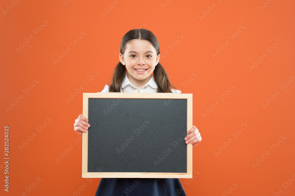 banner concept. blackboard for copy space. information. write hometask. back to school. happy teachers day. 1 september. small girl demonstrate announcement. happy small school girl with chalkboard banner concept. blackboard for copy space. information. write hometask. back to school. happy teachers day. 1 september. small girl demonstrate announcement. happy small school girl with chalkboard