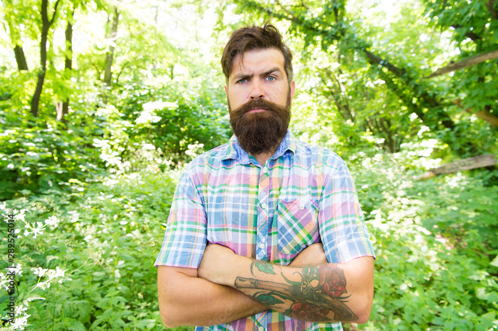 Summer style. Bearded man keeping arms crossed in casual style on natural  landscape. Brutal hipster wearing fashionable mustache and beard hair style  outdoor. In his personal style Stock Photo | Adobe Stock