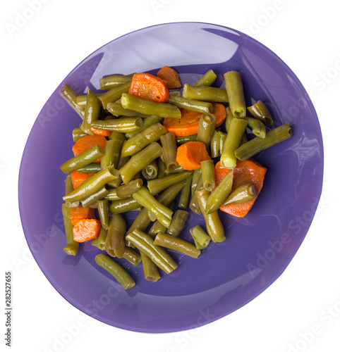 green beans with garlicand carrots  on a plate isolated on white background.green beans with carrot top view. healthy  food photo