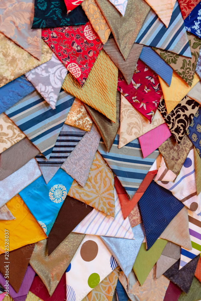 Many multicolored tie fragments create an interesting texture Many multicolored tie fragments create an interesting texture