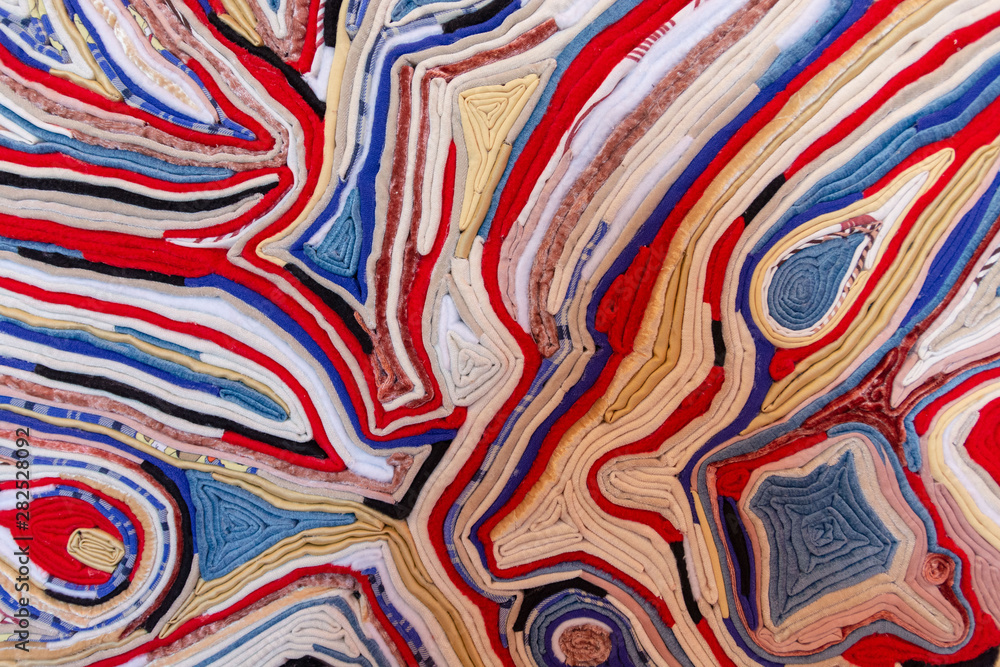 Close-up of multi-colored layers of fabric forming beautiful patterns Close-up of multi-colored layers of fabric forming beautiful patterns