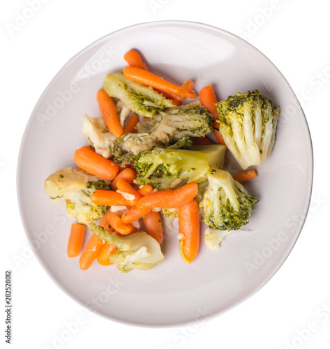 provencal vegetables on a plate.grilled vegetables on a plate isolated on white background.broccoli and carrots on a plate top view.healthy  food