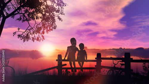 Children on a bike ride sitting on the fence against the backdrop of summer sunset on the river