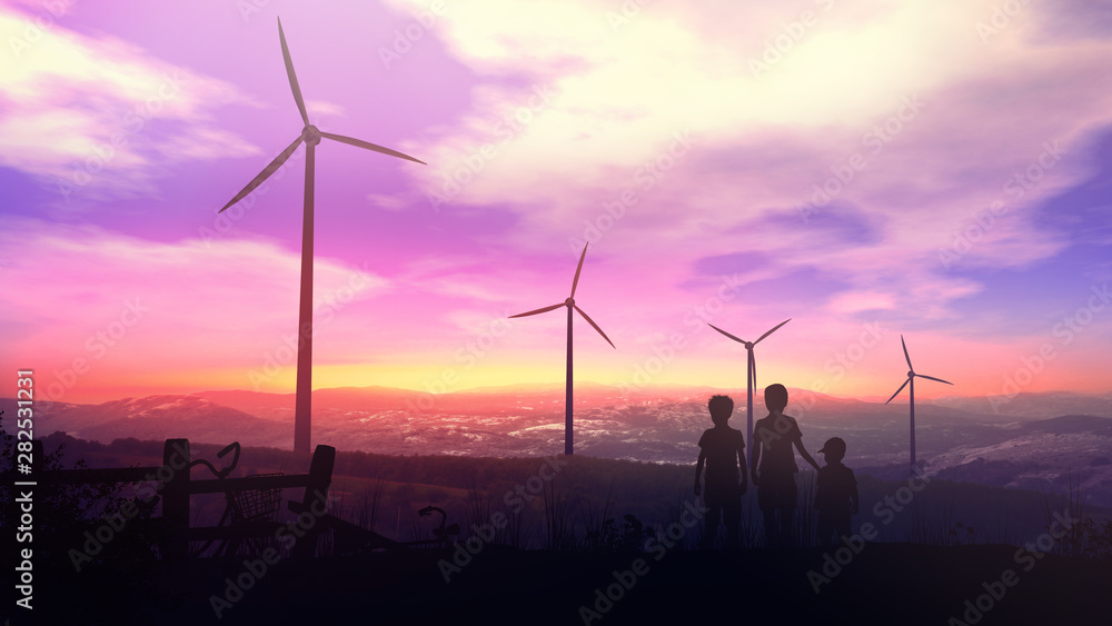 Obraz premium Children at sunset watching the wind power stations work