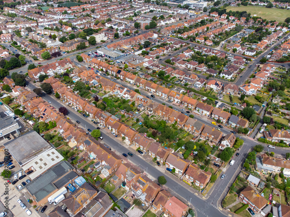 Aerial photo of the town of Worthing, large seaside town in England, and district with borough status in West Sussex, England UK, showing typical housing estates and businesses on a bright sunny day