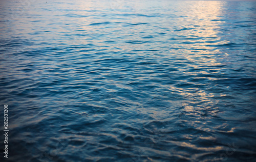Blue abstract background. Calm sea water surface background.
