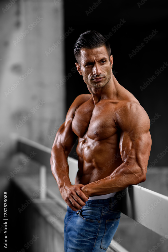 Fototapeta premium Handsome Shirtless Muscular Men in Jeans Posing Outdoors