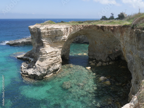 Torre Sant'Andrea in Salento is famous for its wild landscape characterized by jagged rocky coast with turquoise water and full of stacks and caves generated by wind erosion.